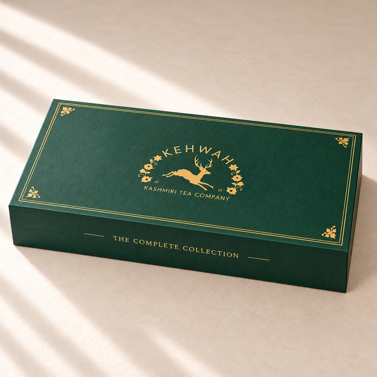 The Complete Collection with Saffron forest-green gift box, closed, with gold Kehwah artwork.