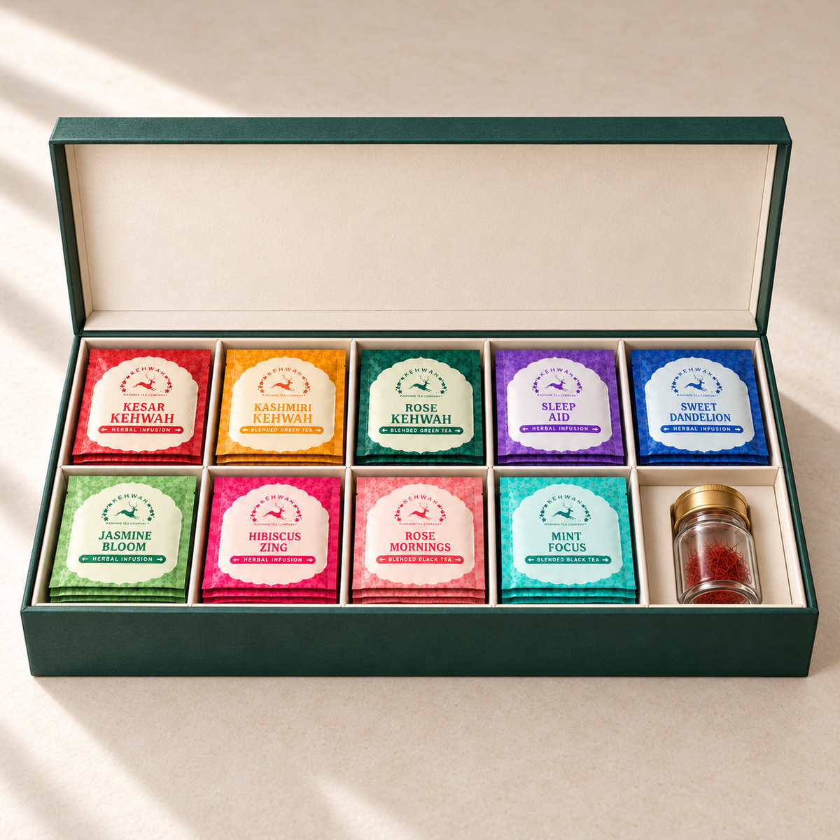 The Complete Collection with Saffron open gift box with 45 tea bags and a 1 g saffron jar in separate ivory compartments.
