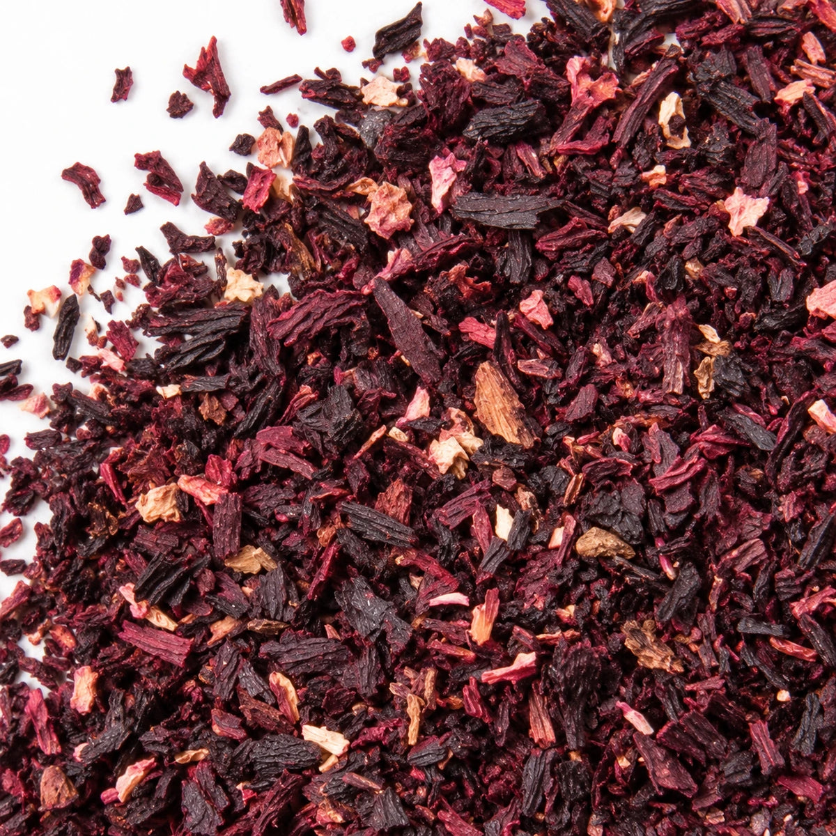Dried hibiscus pieces on a white background