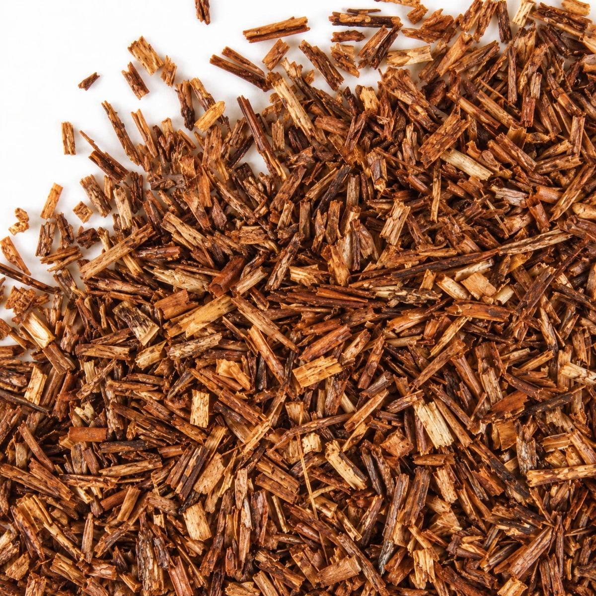 Dried rooibos leaves on a white background