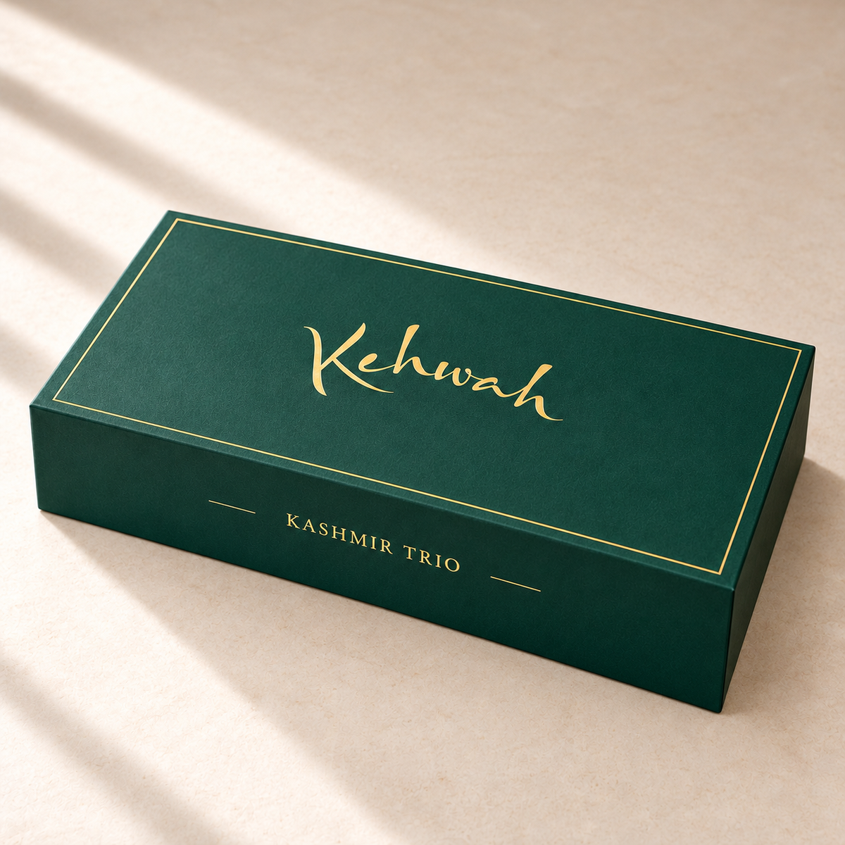 Kashmir Trio with Saffron forest-green gift box, closed, with gold Kehwah artwork.