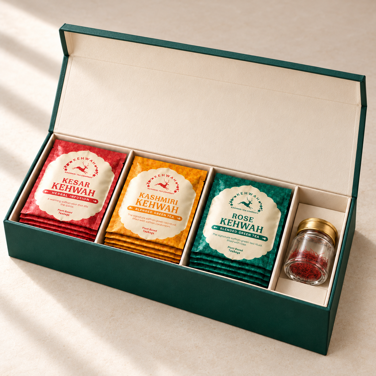 Kashmir Trio with Saffron open gift box with 15 tea bags and a 1 g saffron jar in separate ivory compartments.