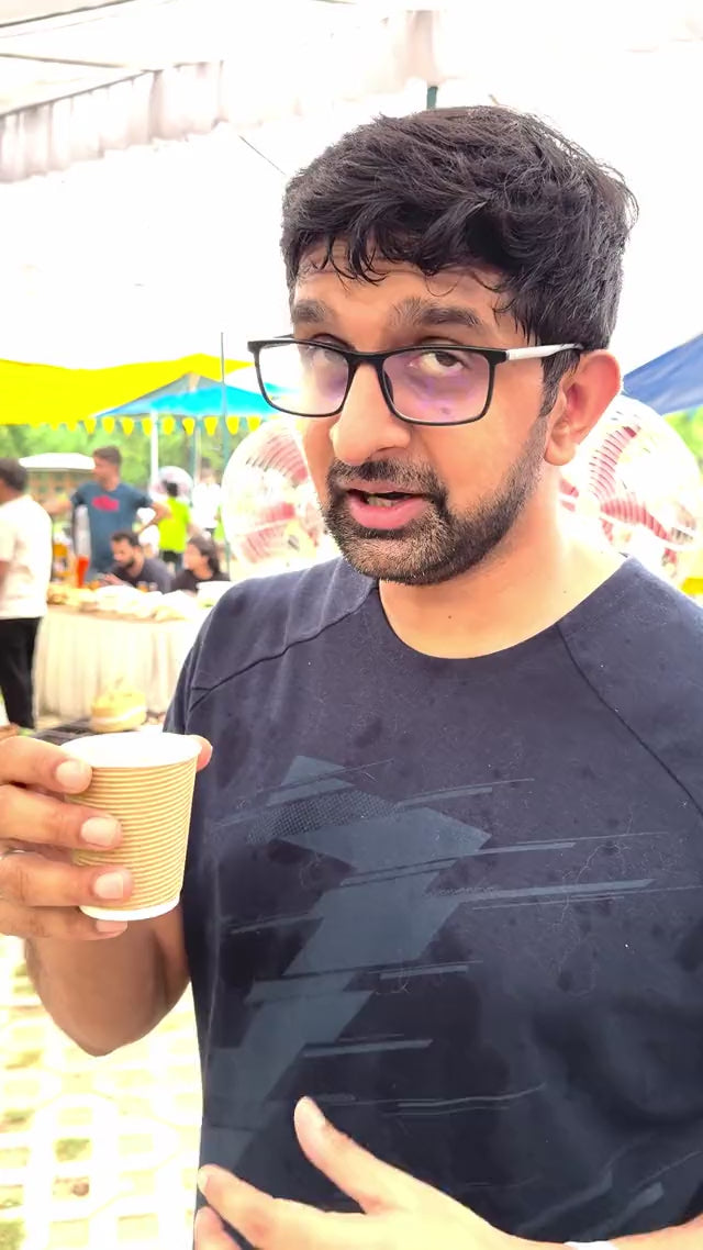 A visitor recognising saffron at the Kehwah tasting table