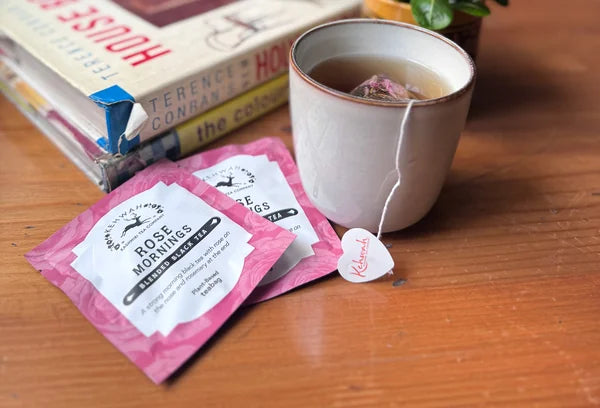 A close view of Rose Mornings with its heart-shaped tea tag